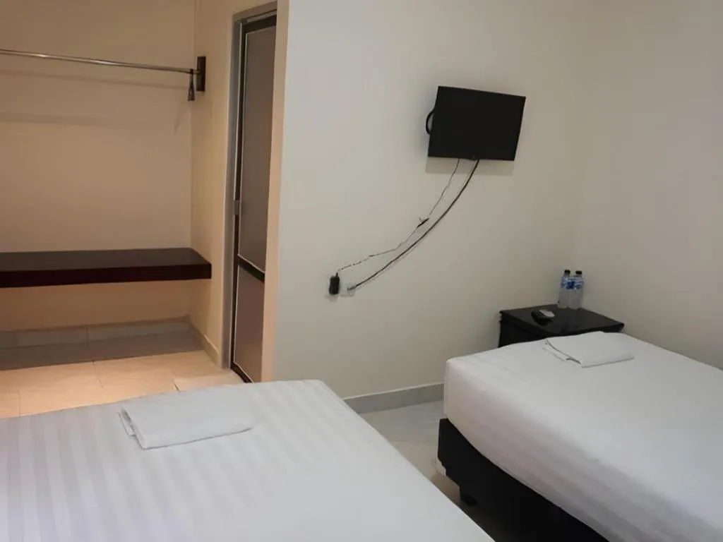 Bed in The Garden Hotel