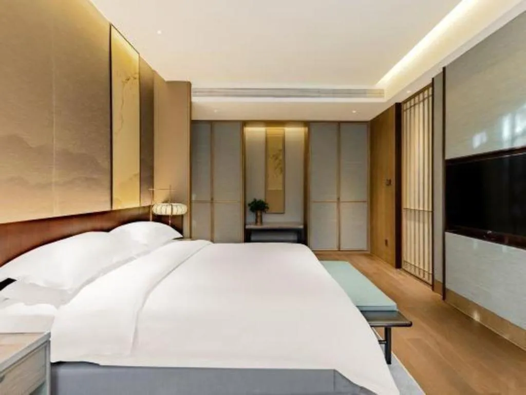 Bed in Wuxi Shanse Hotel