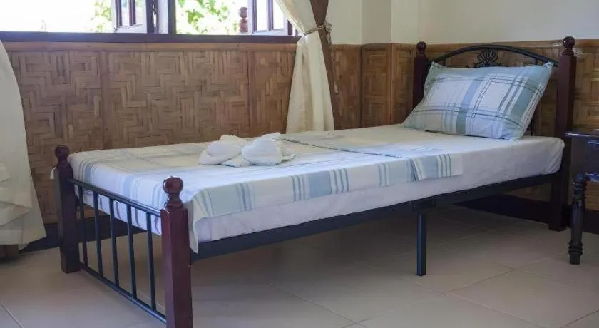 Bed in Coucou Bar Hotel and Restaurant