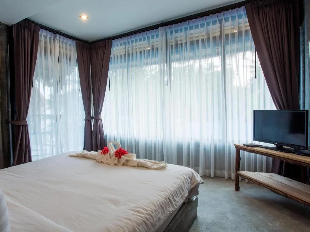 Bed in Koh Mook De Tara Beach Resort