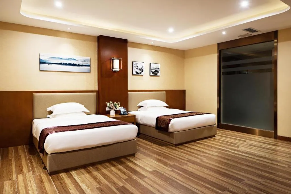 Bed in Cheermore Recreation Hotel Guangzhou Zhimao Yuan Ecological Spa Leisure Hotel