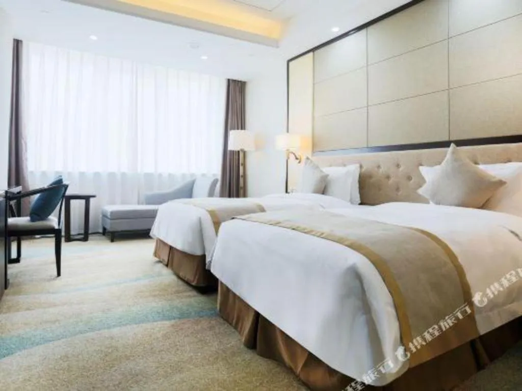 Bed in Hundred Hotel Qingdao