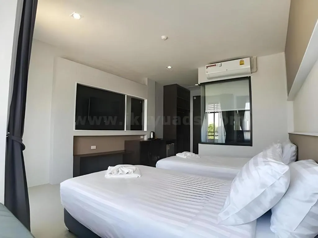 Bed in S-Tawan Hotel & Convention