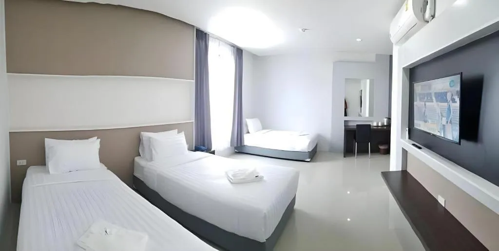Bed in S-Tawan Hotel & Convention