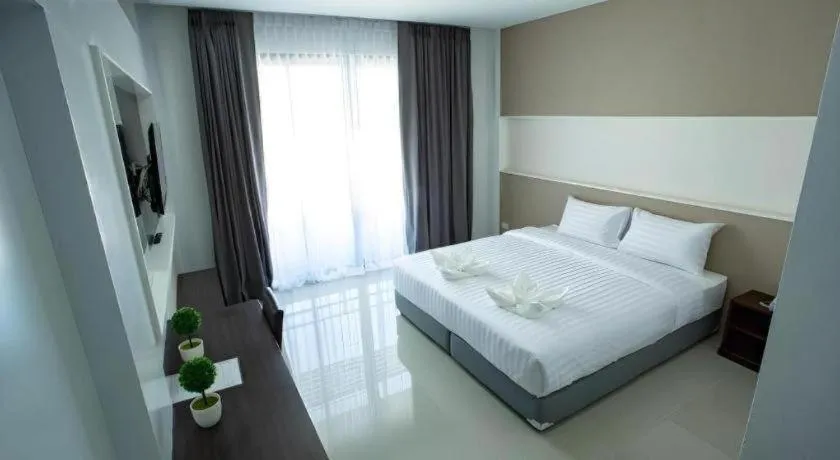 Bed in S-Tawan Hotel & Convention