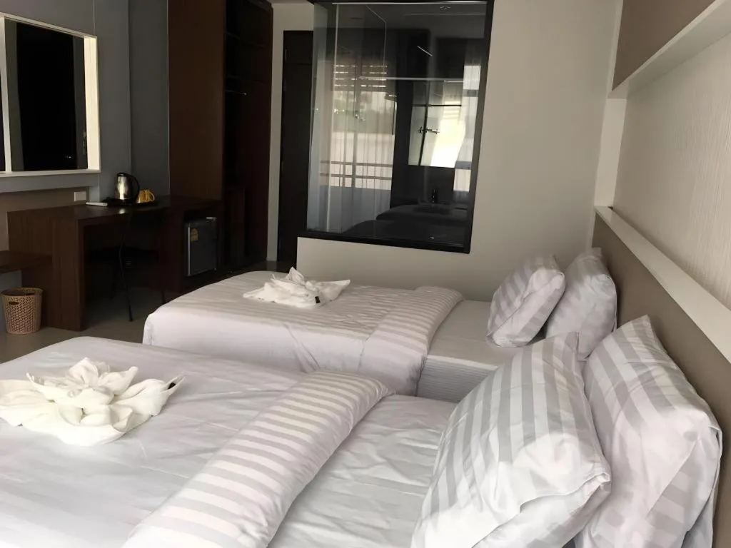 Bed in S-Tawan Hotel & Convention