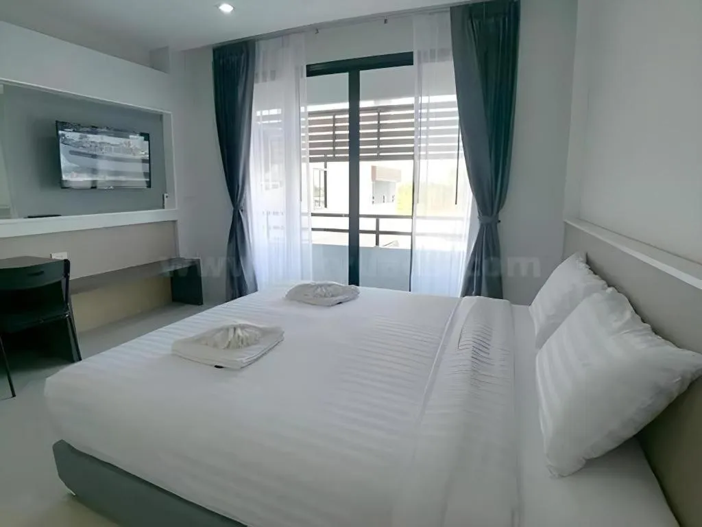 Bed in S-Tawan Hotel & Convention