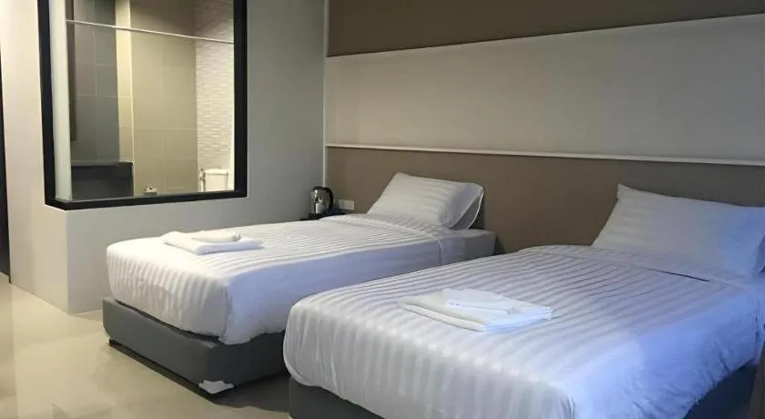 Bed in S-Tawan Hotel & Convention