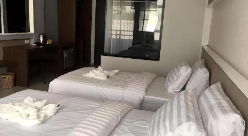 Bed in S-Tawan Hotel & Convention