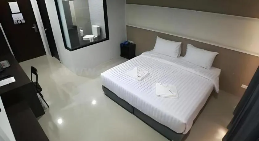 Bed in S-Tawan Hotel & Convention