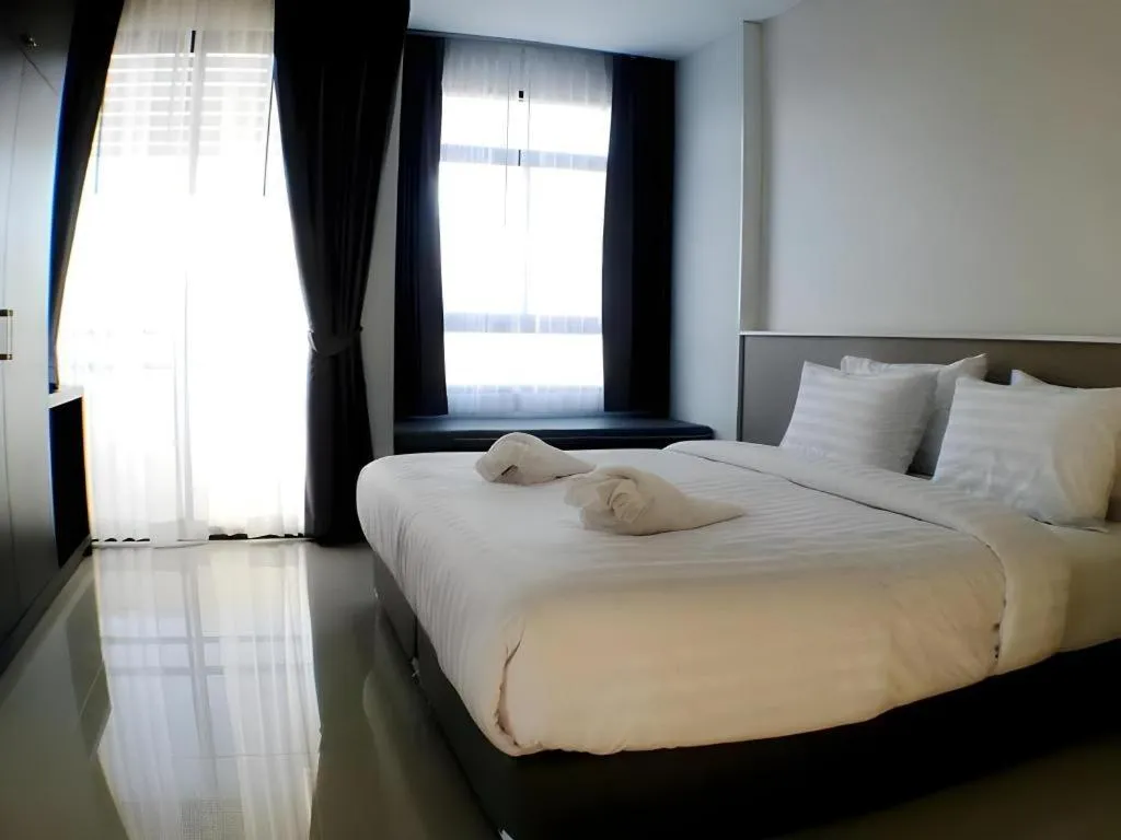 Bed in S-Tawan Hotel & Convention