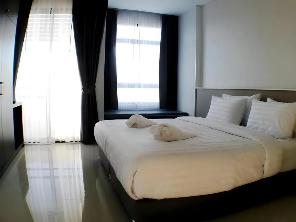 Bed in S-Tawan Hotel & Convention