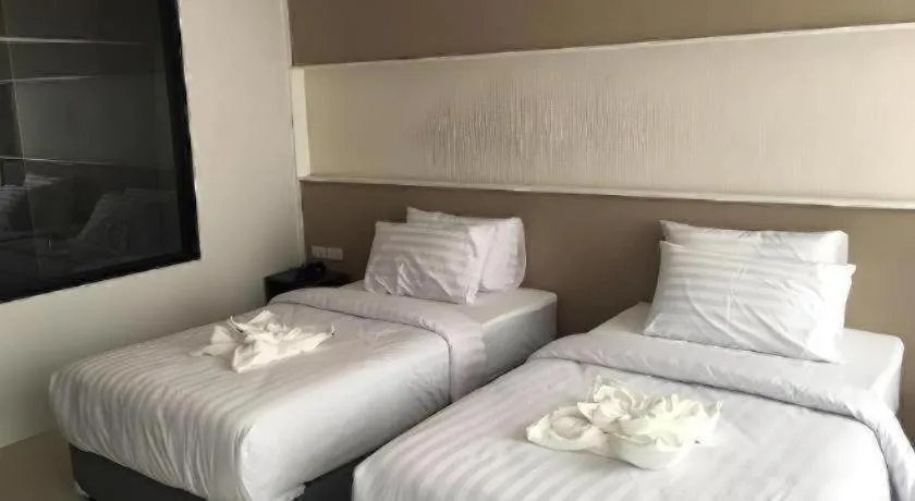 Bed in S-Tawan Hotel & Convention