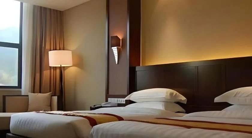 Bed in Longyan Capital International Hot Spring Resort