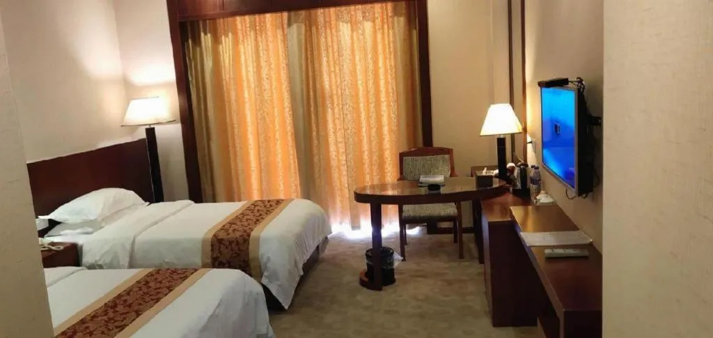 Bed in Longyan Capital International Hot Spring Resort