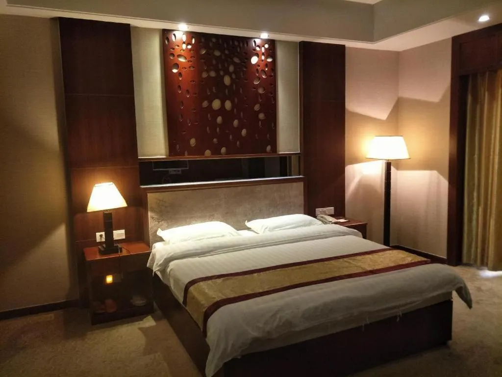Bed in Longyan Capital International Hot Spring Resort