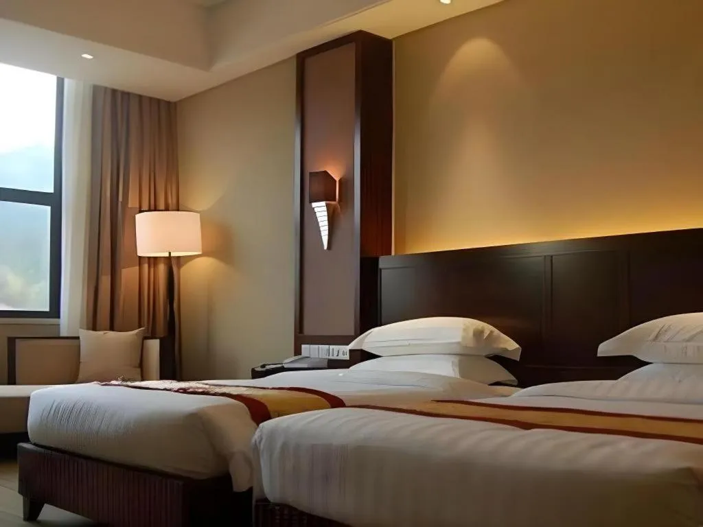 Bed in Longyan Capital International Hot Spring Resort