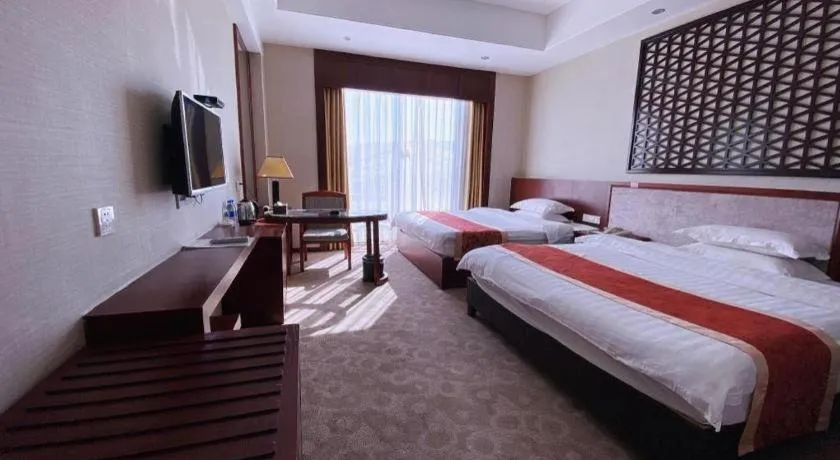 Bed in Longyan Capital International Hot Spring Resort