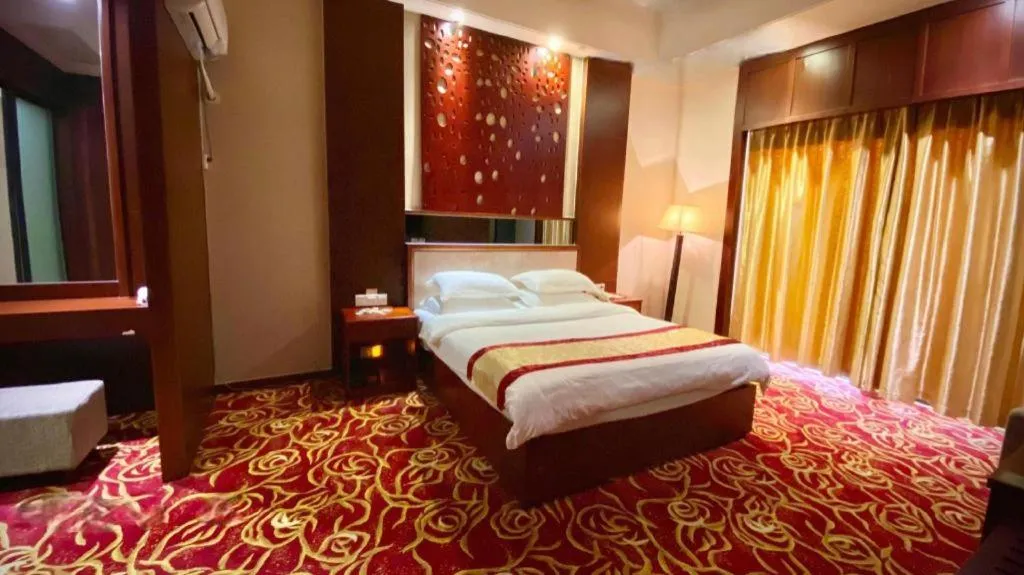 Bed in Longyan Capital International Hot Spring Resort