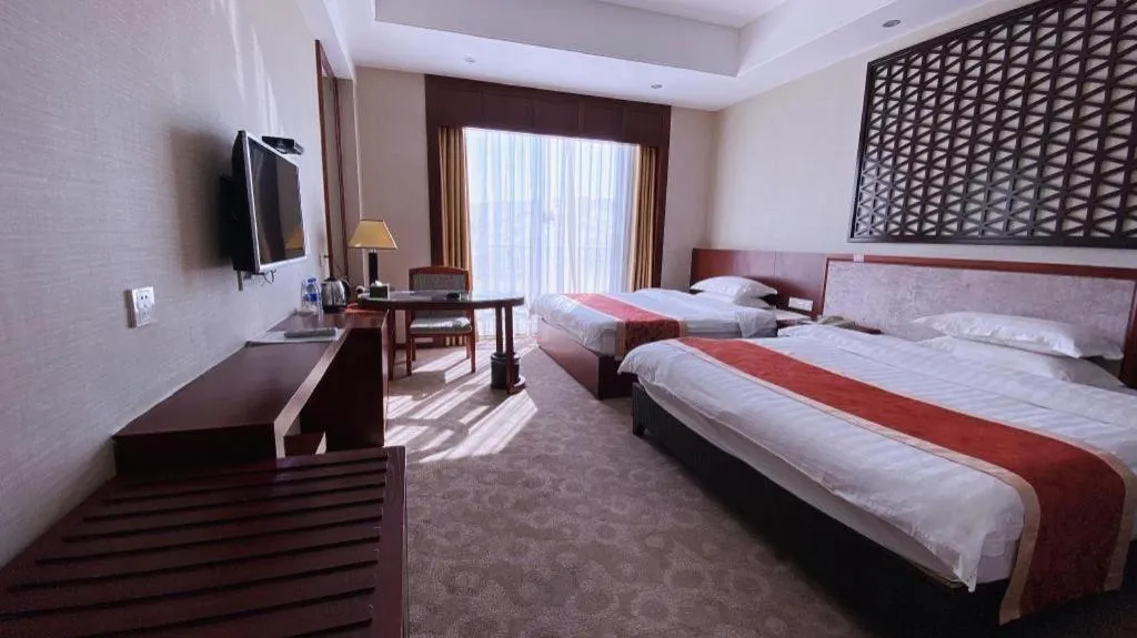 Bed in Longyan Capital International Hot Spring Resort