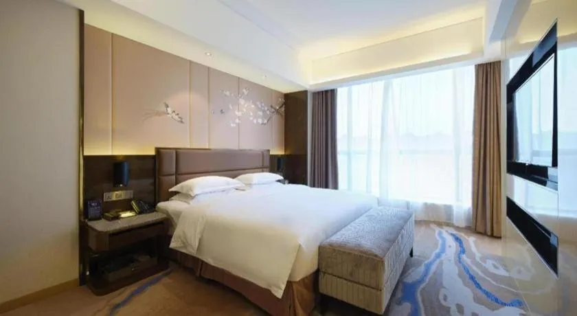 Bed in Licai Tianqi Hotel