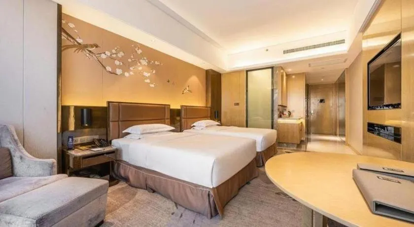 Bed in Licai Tianqi Hotel