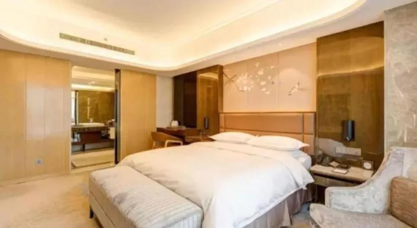 Bed in Licai Tianqi Hotel