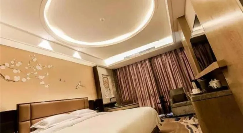 Bed in Licai Tianqi Hotel