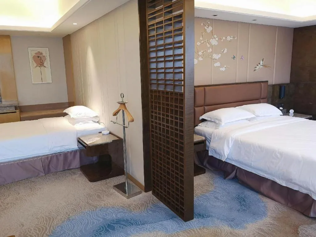 Bed in Licai Tianqi Hotel