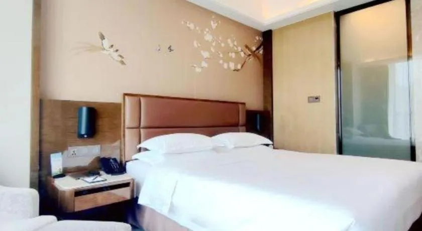 Bed in Licai Tianqi Hotel