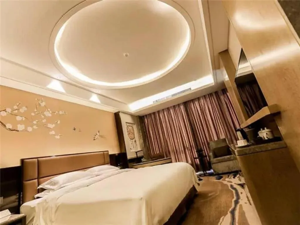 Bed in Licai Tianqi Hotel