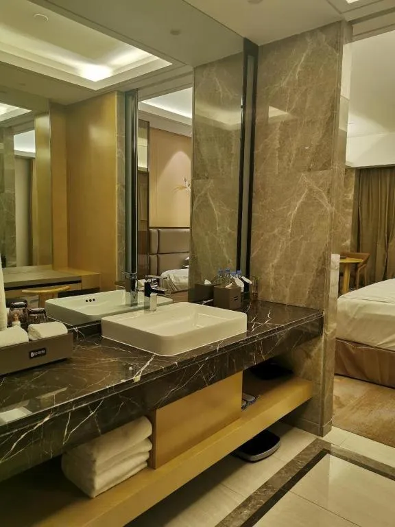 Bed in Licai Tianqi Hotel