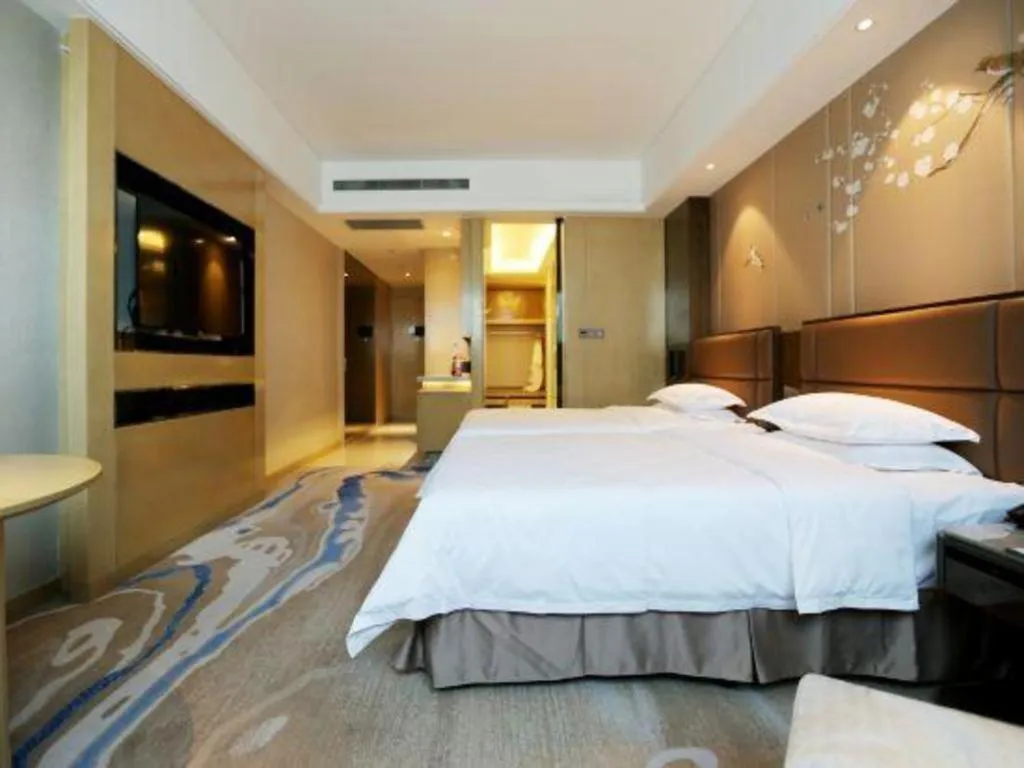 Bed in Licai Tianqi Hotel