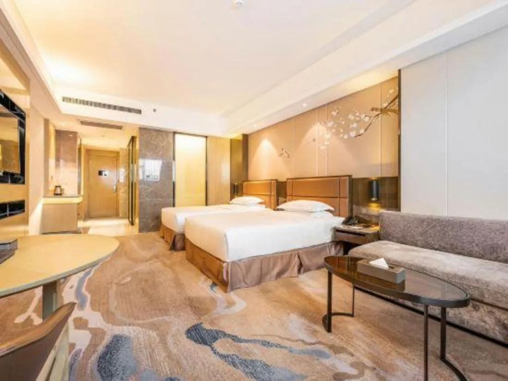 Bed in Licai Tianqi Hotel