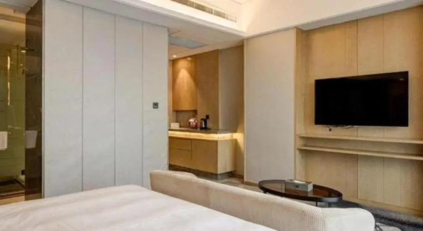 Bed in Licai Tianqi Hotel