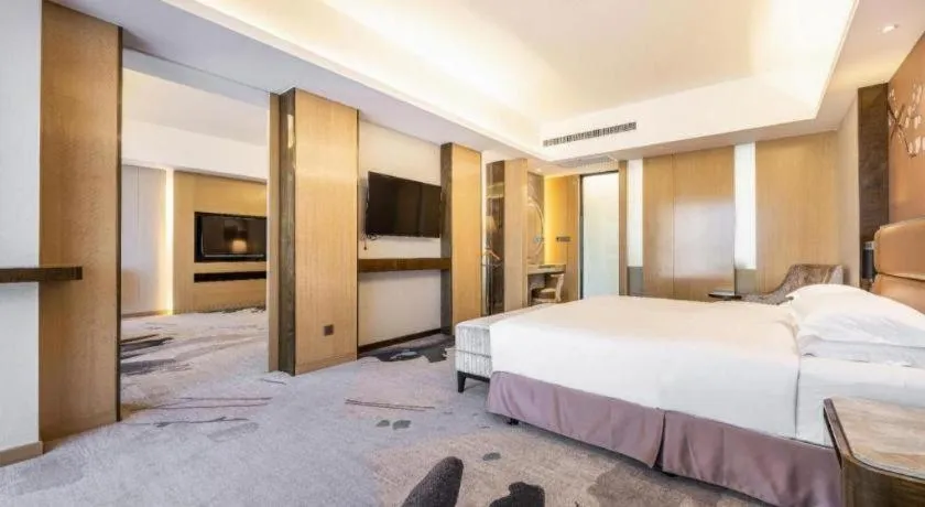 Bed in Licai Tianqi Hotel