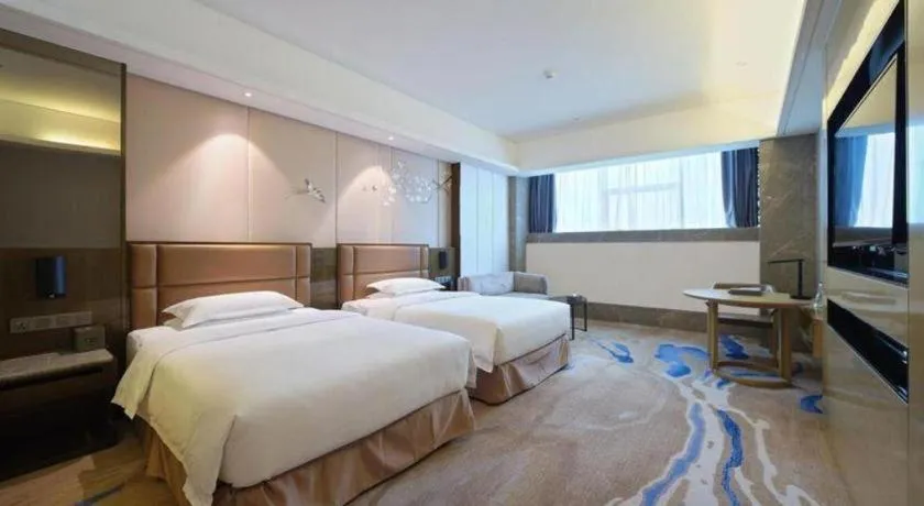 Bed in Licai Tianqi Hotel