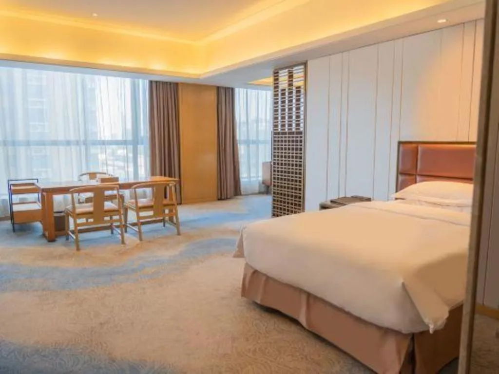 Bed in Licai Tianqi Hotel