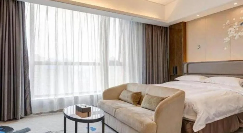 Bed in Licai Tianqi Hotel