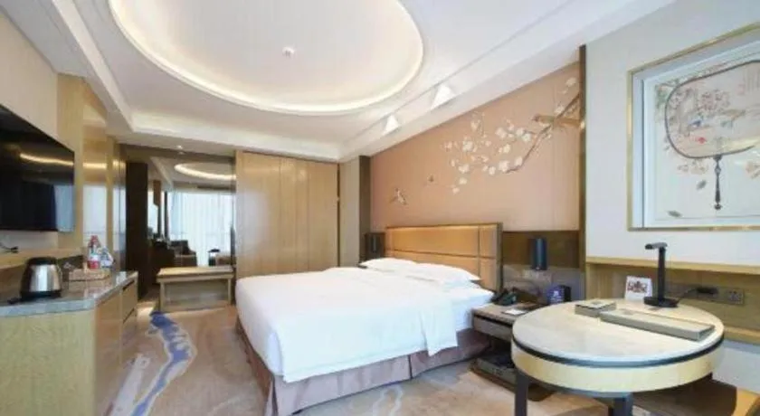 Bed in Licai Tianqi Hotel