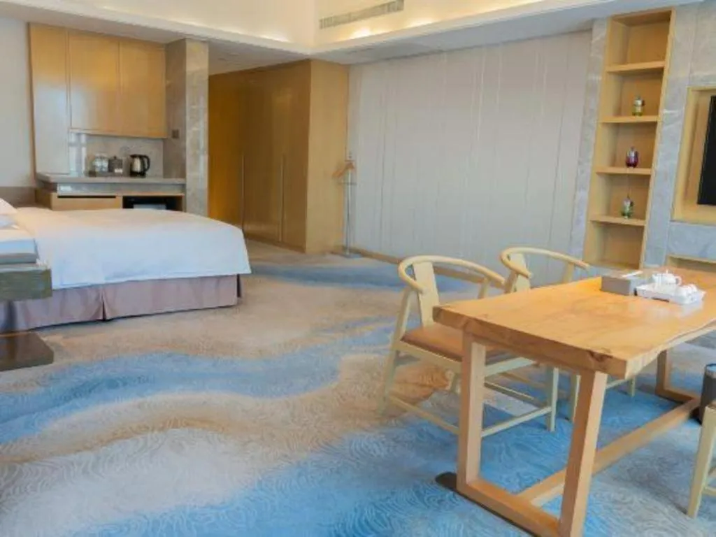 Bed in Licai Tianqi Hotel