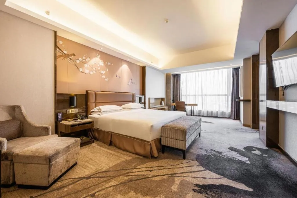 Bed in Licai Tianqi Hotel