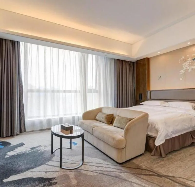 Bed in Licai Tianqi Hotel