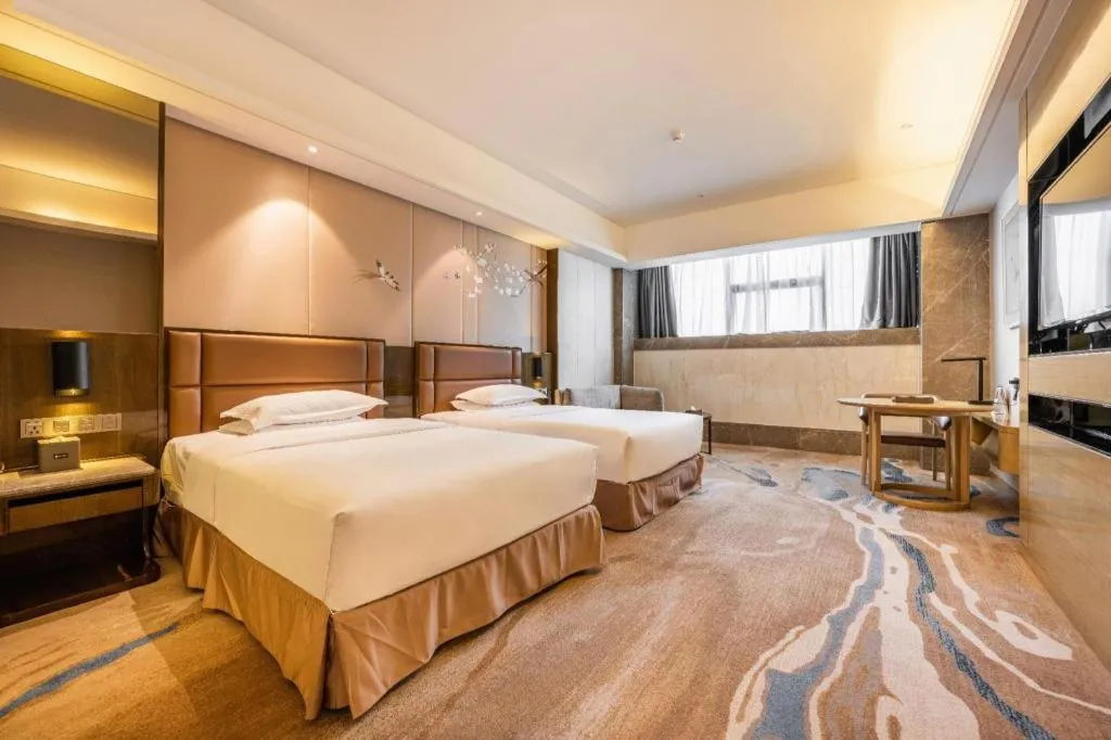 Bed in Licai Tianqi Hotel