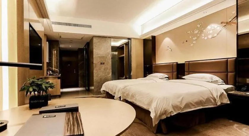 Bed in Licai Tianqi Hotel