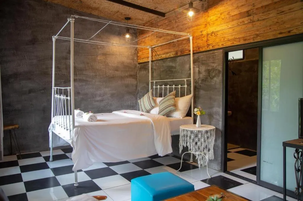 Bed in Le Bassin Erawan Resort