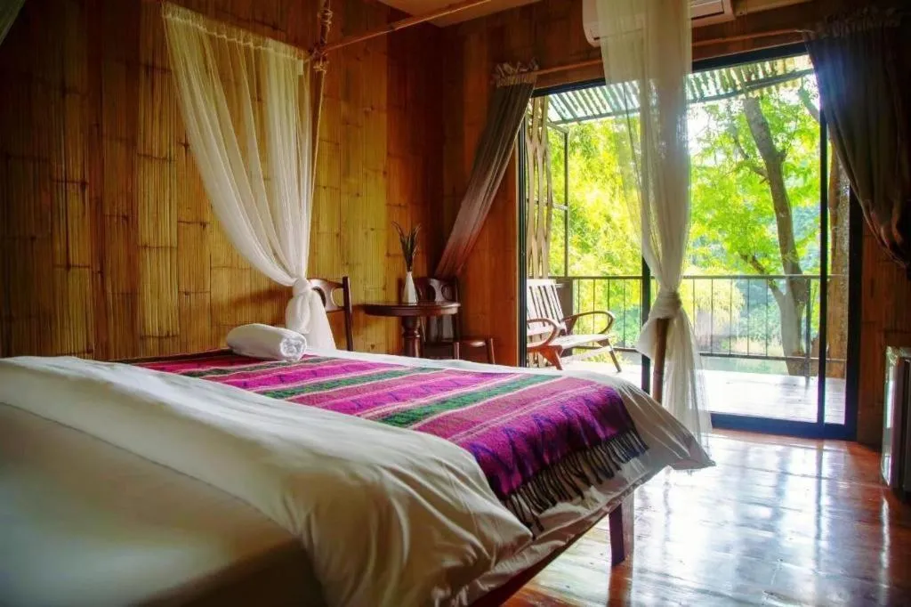 Bed in Le Bassin Erawan Resort