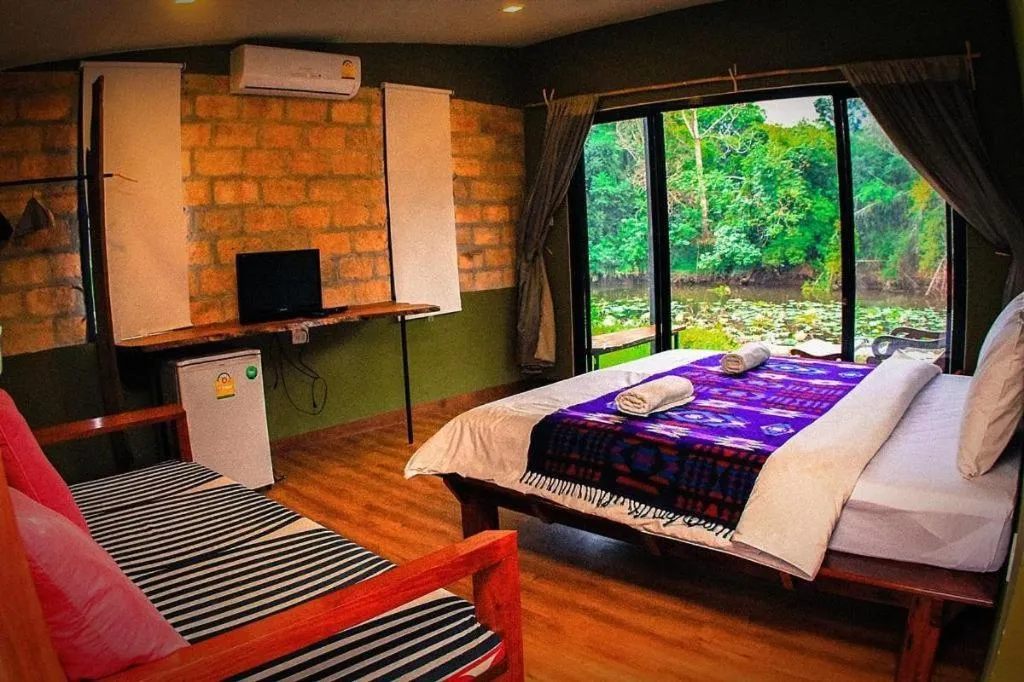 Bed in Le Bassin Erawan Resort