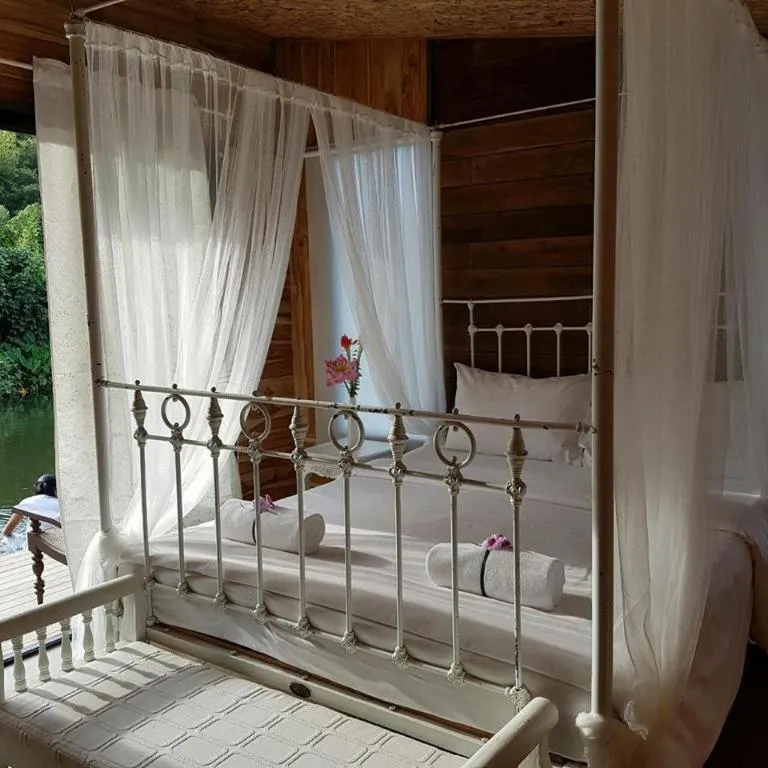 Bed in Le Bassin Erawan Resort