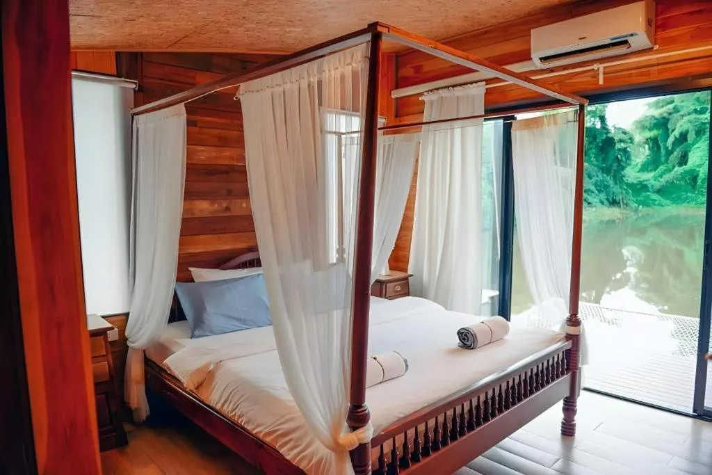 Bed in Le Bassin Erawan Resort